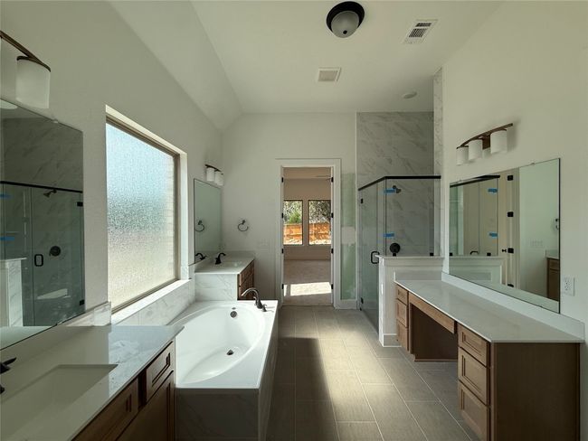 Primary Bath with dual vanities and garden tub | Image 10