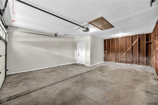 Garage featuring a garage door opener | Image 39