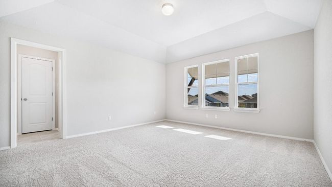 Empty room featuring carpet and lofted ceiling | Image 11