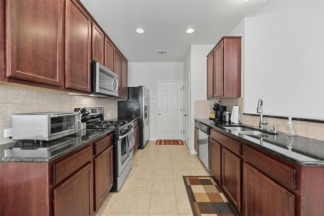 Kitchen with access to private garage | Image 8