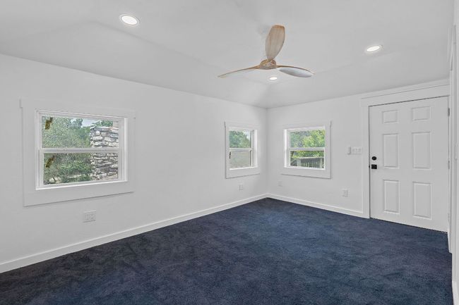 Spare room with dark carpet, ceiling fan, and recessed lighting | Image 12
