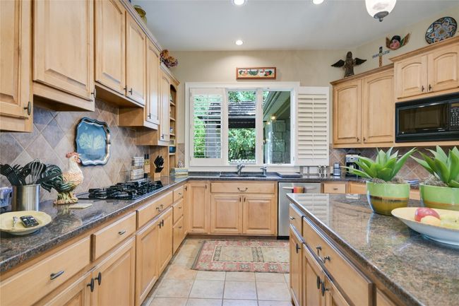 Window over the kitchen sink brings in natural light | Image 13