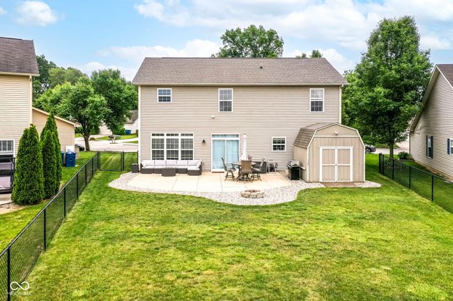 back of house featuring a patio area and a fire pit | Image 32
