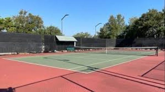 View of tennis court with community basketball court | Image 39
