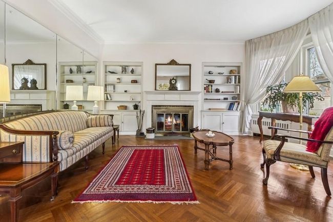 Living room showing woodburning fireplace | Image 7