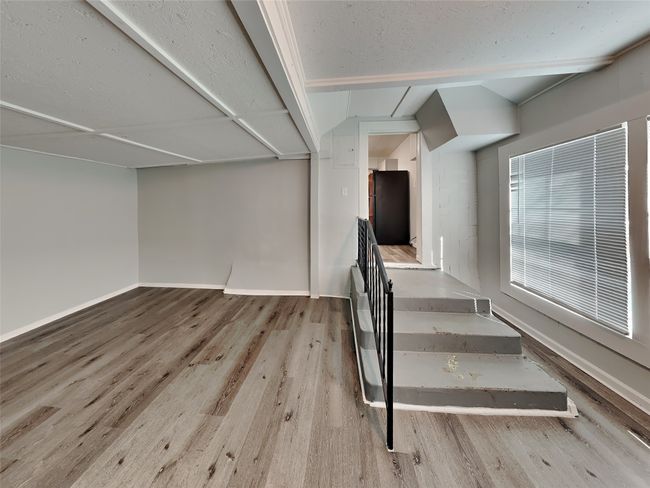 Stairway with wood finished floors and baseboards | Image 12