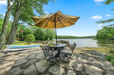 View of patio / terrace featuring a water view | Image 3