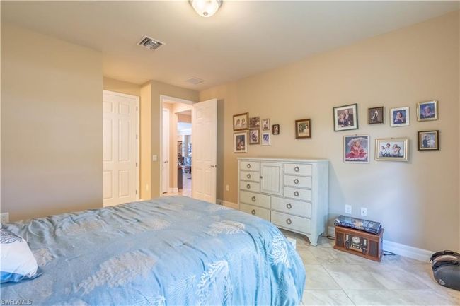 Walk in closet featuring light tile patterned floors | Image 28