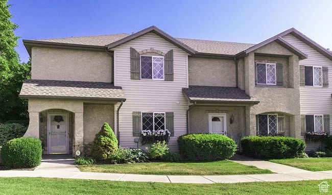 View of front of house featuring stucco siding and a shingled roof | Image 28