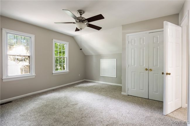 3rd bedroom with carpet, ceiling fan, and vaulted ceiling | Image 19