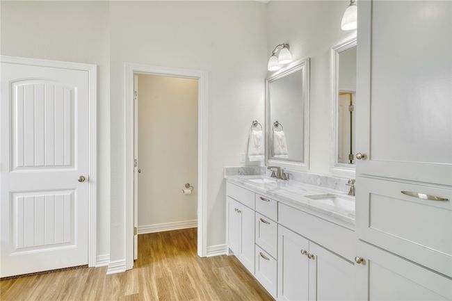 Full bathroom with wood finished floors and double vanity | Image 18