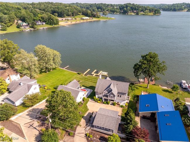 Aerial perspective of suburban area with a nearby body of water | Image 21