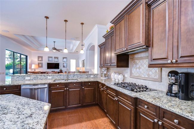 A spacious open layout seamlessly flows into a cozy living area, perfect for entertaining or relaxing. | Image 12