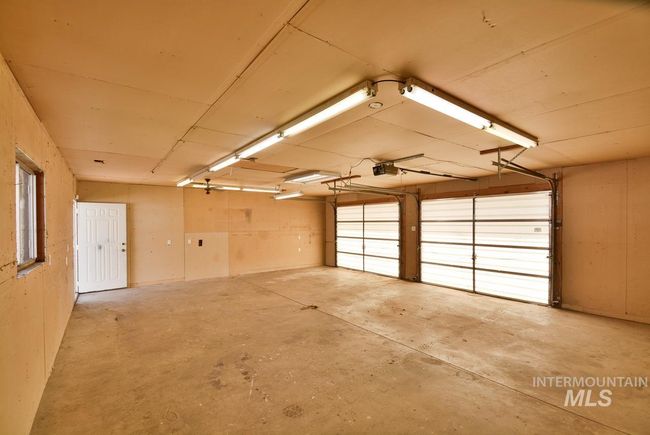 Garage featuring a garage door opener | Image 41