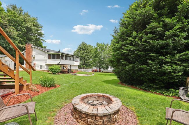 Split foyer home featuring a chimney and brick siding | Image 36