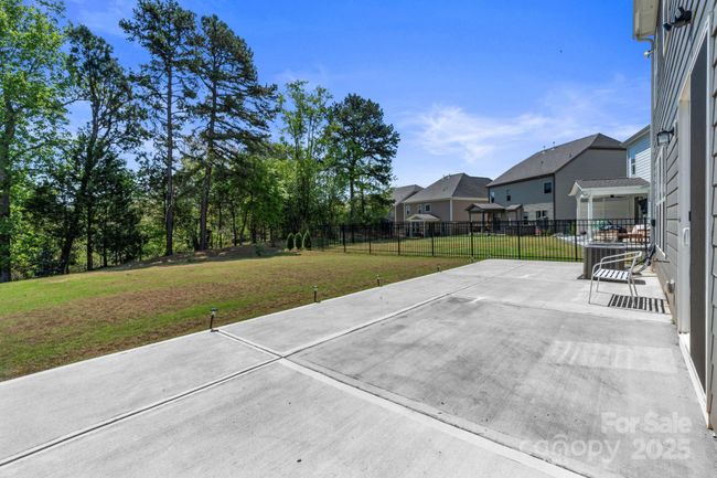Oversized patio w/ gas grill hookup. Level Yard, Overlooking trees | Image 41
