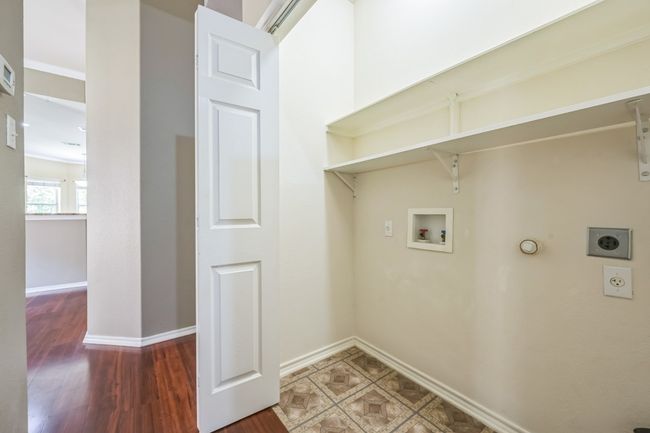 Additional highlights include an interior laundry closet, attached 2-car garage, and water softener system. | Image 26
