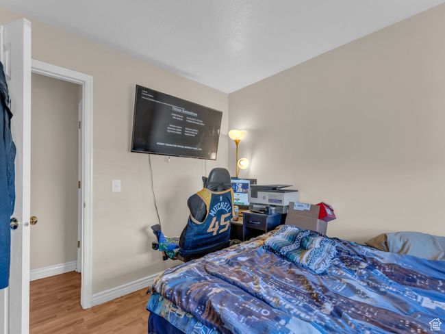Bedroom featuring wood finished floors and baseboards | Image 33