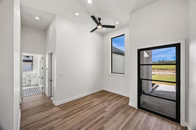 Entry area with high ceilings and space for small home office | Image 3