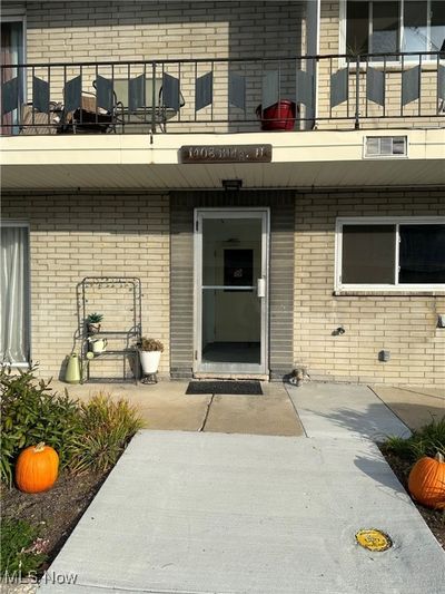 Property entrance with a balcony | Image 2