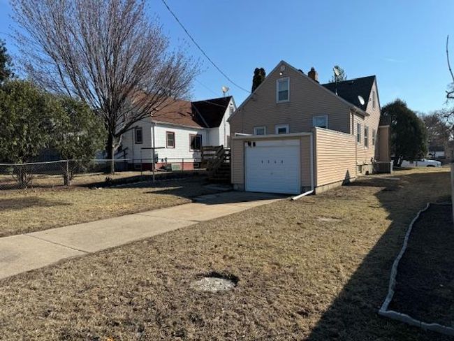 Attached Garage, concrete driveway, Space for two off street parking vehicles | Image 28