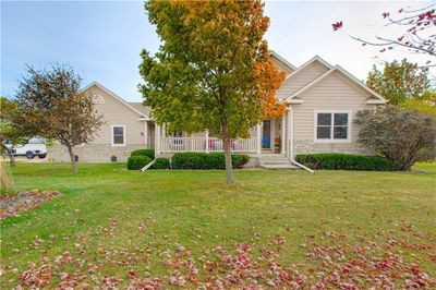 Relax and take in the tranquility of 9.55 acres from the expansive front porch—an ideal spot for morning coffee and evening stargazing. | Image 2