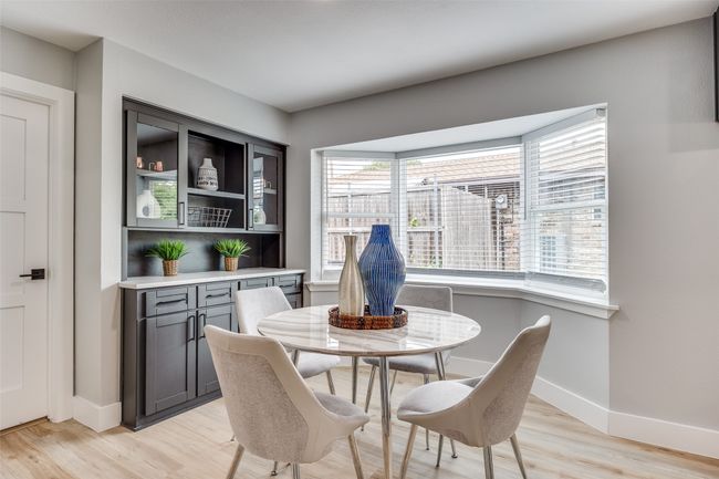 Dining space with light wood-style flooring and baseboards | Image 17