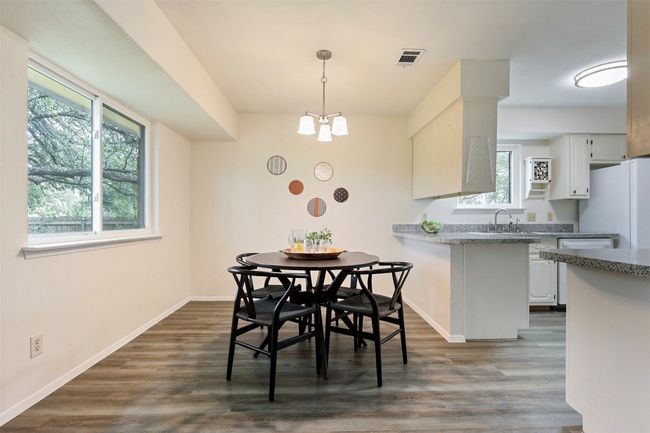 Dining room adjacent to patio entry and kitchen. | Image 9
