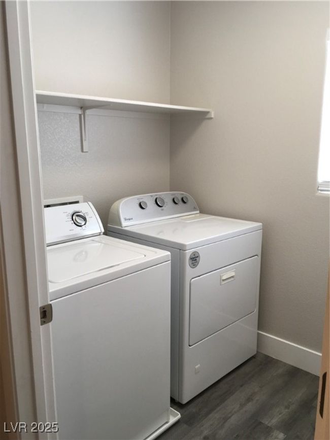 Laundry room featuring washer and dryer, dark wood-style floors, laundry area, and baseboards | Image 20