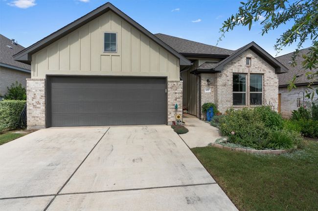 View of front of house featuring an attached tandem 2.5 garage and driveway | Image 36
