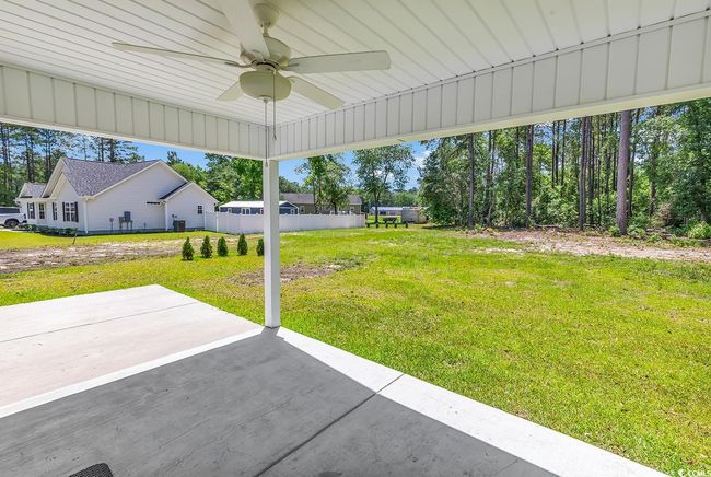 View of yard featuring a patio and a ceiling fan | Image 33