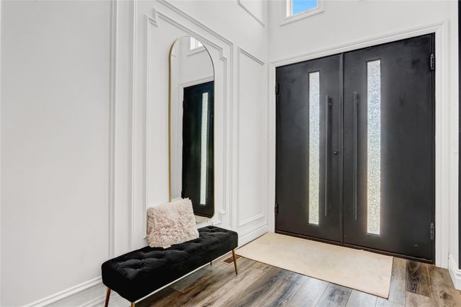 Foyer entrance with wood finished floors | Image 14