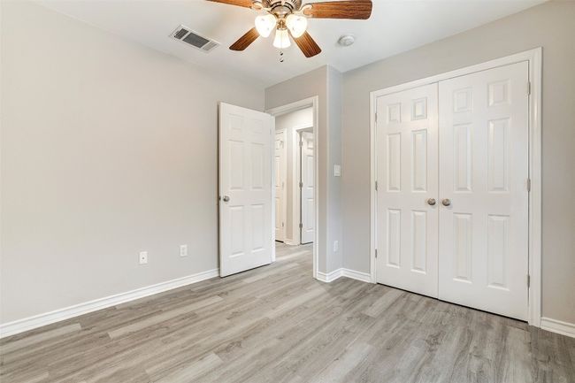 front facing bedroom with ceiling fan | Image 23