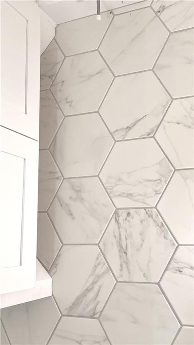 Designer-selected octagonal tile is both classic and modern at the same time. | Image 48