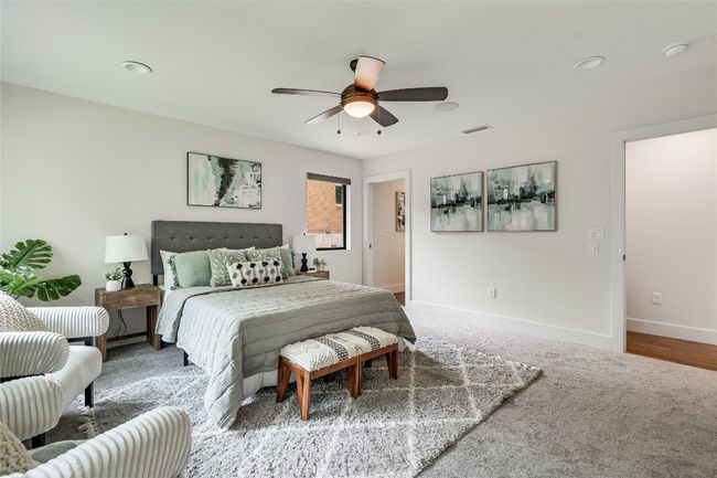 This home provides a home office plus three bedrooms including this large and secluded primary suite. | Image 23