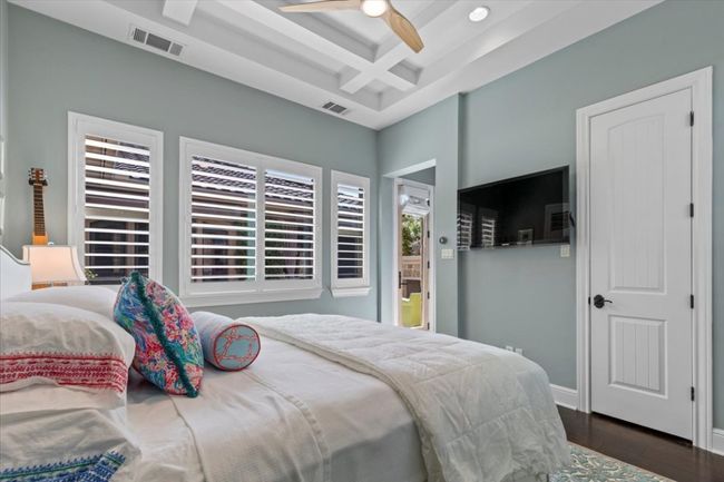 Bedroom featuring beamed ceiling, visible vents, dark wood-style flooring, and coffered ceiling | Image 27