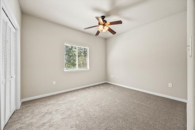 Unfurnished bedroom with carpet, a closet, and baseboards | Image 20
