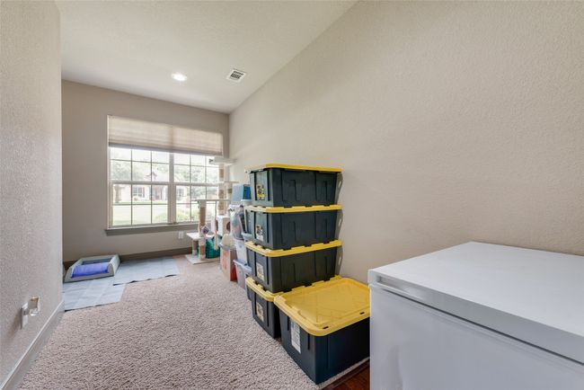 Recreation room featuring carpet flooring and a textured wall | Image 25