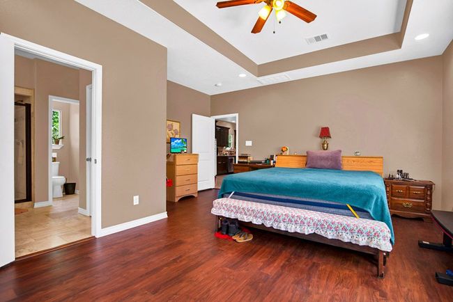 Master bedroom also showing master bathroom in the background | Image 15