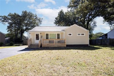 View of front of property featuring a front yard and a deck | Image 1