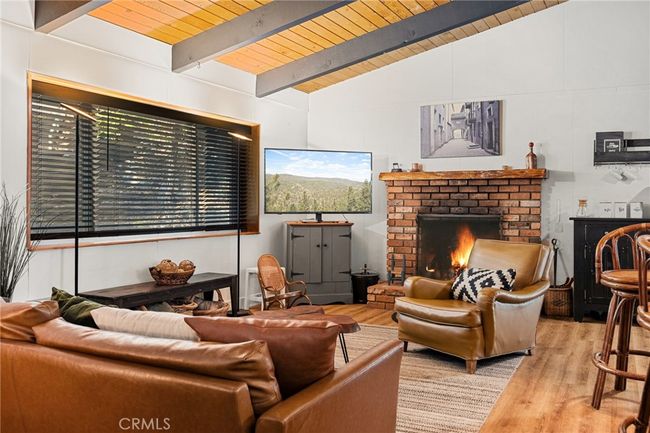 Living room with fireplace. | Image 4