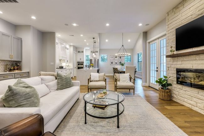 The main house features an open-concept living area that blends the kitchen, living and dining spaces. | Image 16