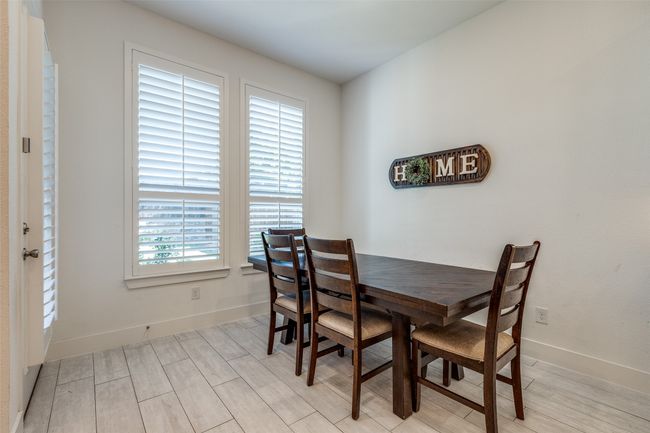 Dining area with baseboards and light wood finished floors | Image 5