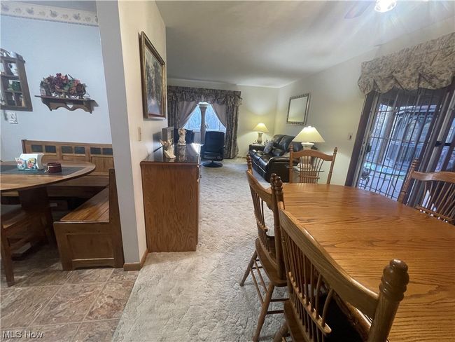 Tiled dining room with ceiling fan | Image 13