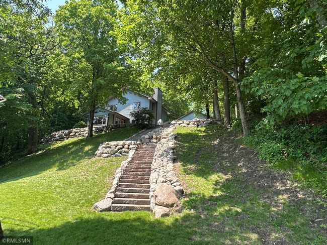 This photo was provided by the sellers. In addition to the docks and lifts, a 12 ft aluminum fishing boat (unlicensed), lake weed rake and assorted lift removal tools will remain. Imagine soaking up that view! | Image 17