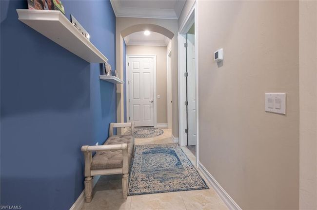 Hallway leading from the Kitchen to Guest Room, Laundry and 3 car Garage | Image 24