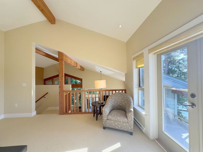 Living area with an upstairs landing and carpet flooring | Image 28