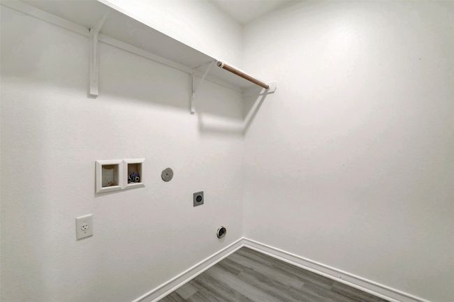 Indoor laundry room with hookup for an electric dryer and washer hookup | Image 16