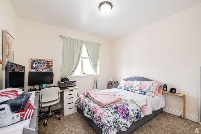 Carpeted bedroom with baseboards | Image 18