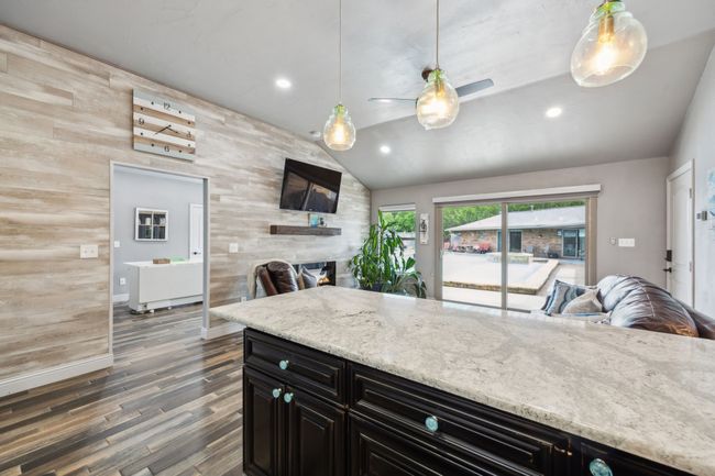Charming Secondary Unit Features an Open-concept Living & Kitchen Space w/Pool Views | Image 32
